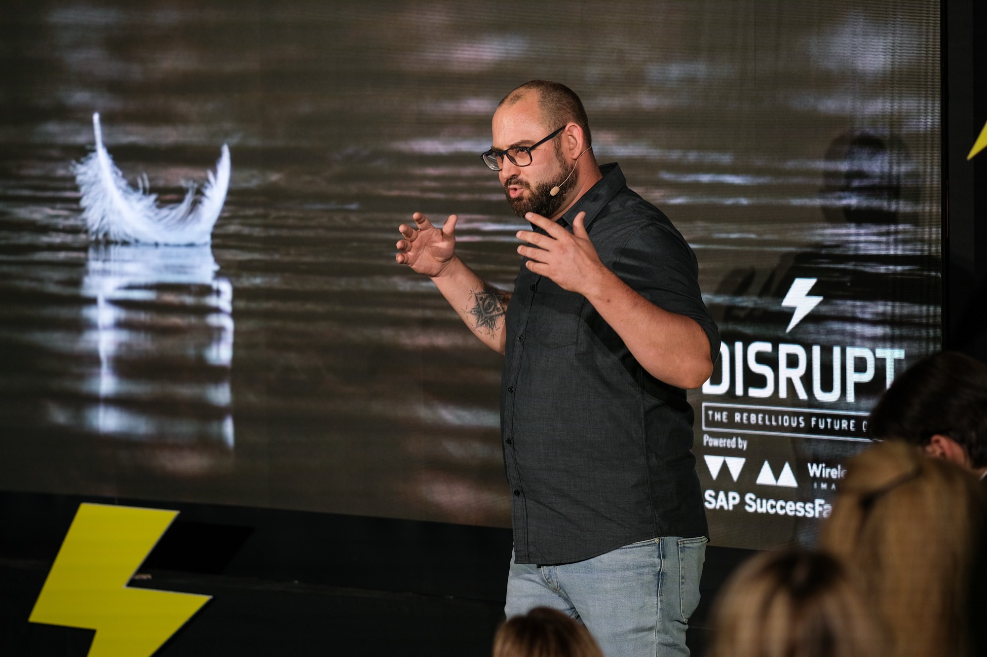 Andre van Kempen mid-gesture on stage at DISRUPT HR Belgrade